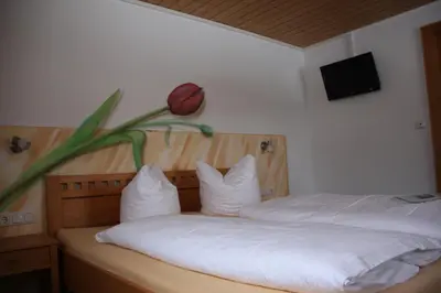 Ein Bett oder Betten in einem Zimmer der Unterkunft Katharinahof Ferienpension
