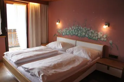 Ein Bett oder Betten in einem Zimmer der Unterkunft Katharinahof Ferienpension