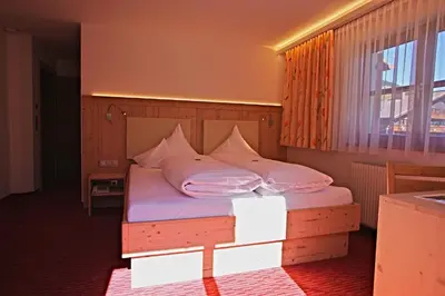 Ein Bett oder Betten in einem Zimmer der Unterkunft Pension Walserheim