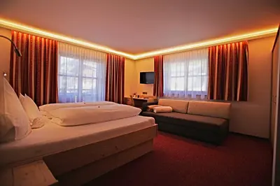 Ein Bett oder Betten in einem Zimmer der Unterkunft Pension Walserheim