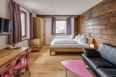 Ein Bett oder Betten in einem Zimmer der Unterkunft Hotel Daneu