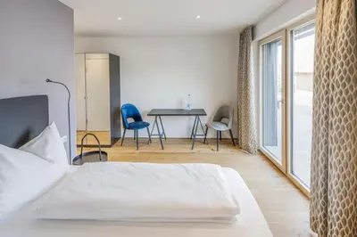 Ein Bett oder Betten in einem Zimmer der Unterkunft Hotel Daneu
