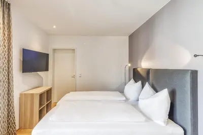 Ein Bett oder Betten in einem Zimmer der Unterkunft Hotel Daneu
