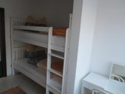 Ein Etagenbett oder Etagenbetten in einem Zimmer der Unterkunft Haus Rünzler