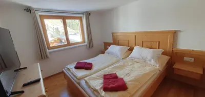 Ein Bett oder Betten in einem Zimmer der Unterkunft Haus Johanneshof 1604