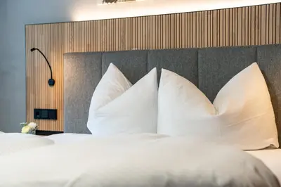 Ein Bett oder Betten in einem Zimmer der Unterkunft Hotel Garni Madrisa