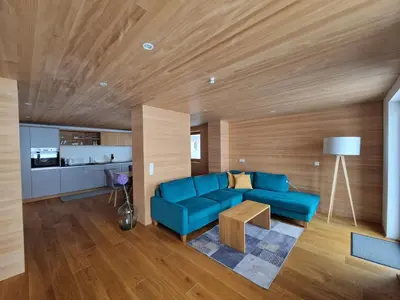 Ein Sitzbereich in der Unterkunft Alphof Appartement Faschina