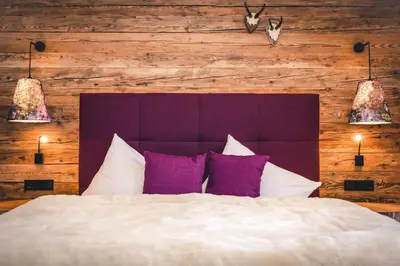 Ein Bett oder Betten in einem Zimmer der Unterkunft LUX ALP CHALET am Arlberg