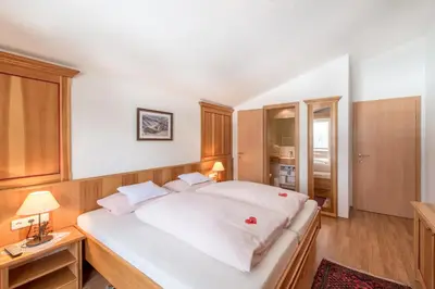 Ein Bett oder Betten in einem Zimmer der Unterkunft Ferienwohnungen & Chalets Capricorno