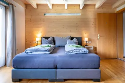 Ein Bett oder Betten in einem Zimmer der Unterkunft Haus Alpina
