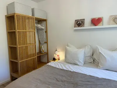 Ein Bett oder Betten in einem Zimmer der Unterkunft Feriendomizil Suldis
