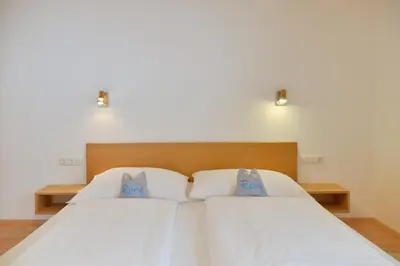 Ein Bett oder Betten in einem Zimmer der Unterkunft Pension Haus Romy