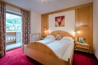 Ein Bett oder Betten in einem Zimmer der Unterkunft Hotel Auenhof