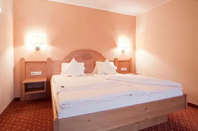 Ein Bett oder Betten in einem Zimmer der Unterkunft Suitehotel Kleinwalsertal