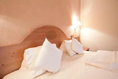 Ein Bett oder Betten in einem Zimmer der Unterkunft Suitehotel Kleinwalsertal