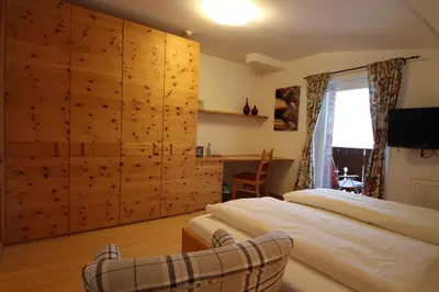 Ein Bett oder Betten in einem Zimmer der Unterkunft Hotel Garni Lärchenhof