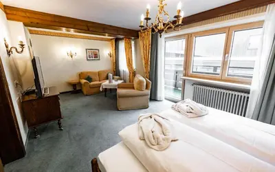 Ein Bett oder Betten in einem Zimmer der Unterkunft Hotel Olympia