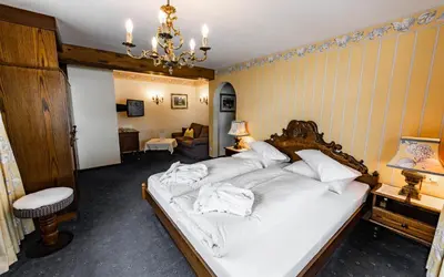 Ein Bett oder Betten in einem Zimmer der Unterkunft Hotel Olympia