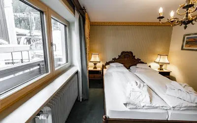 Ein Bett oder Betten in einem Zimmer der Unterkunft Hotel Olympia