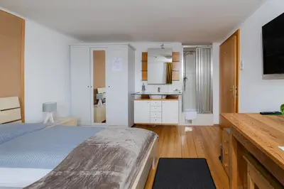 Ein Bett oder Betten in einem Zimmer der Unterkunft Gasthaus Moosegg