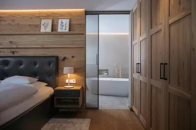 Ein Bett oder Betten in einem Zimmer der Unterkunft Hotel Arlberg Lech