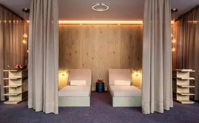 Ein Bett oder Betten in einem Zimmer der Unterkunft Hotel Arlberg Lech