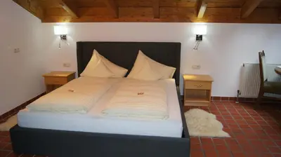 Ein Bett oder Betten in einem Zimmer der Unterkunft Hotel Hartenfels
