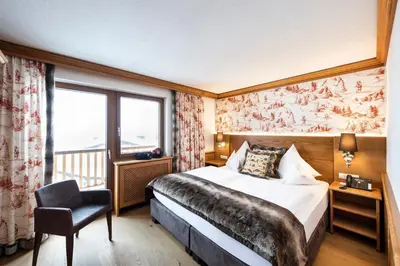 Ein Bett oder Betten in einem Zimmer der Unterkunft Hotel & Chalet Montana
