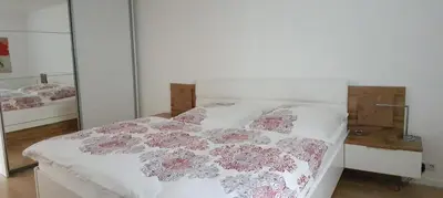 Ein Bett oder Betten in einem Zimmer der Unterkunft F E R I E N W O H N U N G 