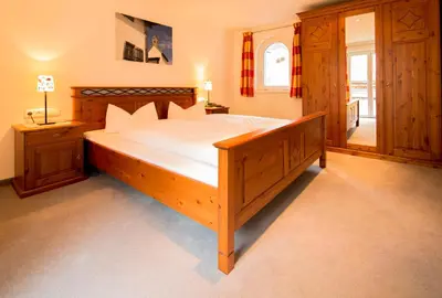 Ein Bett oder Betten in einem Zimmer der Unterkunft Haus Landbrugg