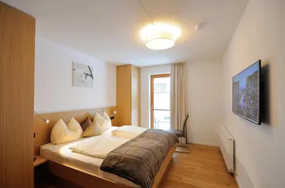 Ein Bett oder Betten in einem Zimmer der Unterkunft Appartements Lenzikopf