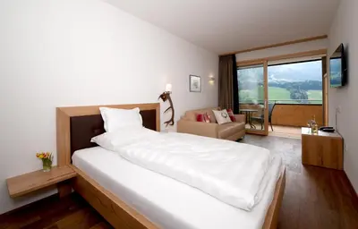 Ein Bett oder Betten in einem Zimmer der Unterkunft Hotel St Hubertus