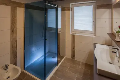 Ein Badezimmer in der Unterkunft Hotel Sonnalpen