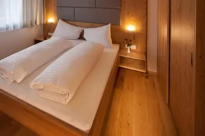 Ein Bett oder Betten in einem Zimmer der Unterkunft Hotel Sonnalpen