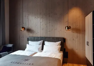 Ein Bett oder Betten in einem Zimmer der Unterkunft Hotel Alpenstern