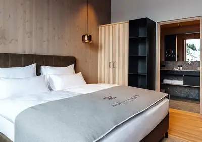 Ein Bett oder Betten in einem Zimmer der Unterkunft Hotel Alpenstern