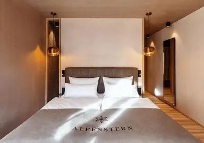 Ein Bett oder Betten in einem Zimmer der Unterkunft Hotel Alpenstern