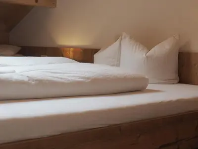 Ein Bett oder Betten in einem Zimmer der Unterkunft Bergerhof Fontanella