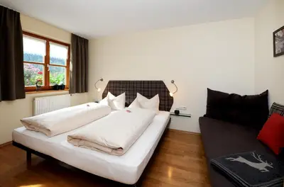 Ein Bett oder Betten in einem Zimmer der Unterkunft Ferienwohnungen Erath