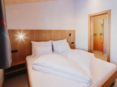 Ein Bett oder Betten in einem Zimmer der Unterkunft Alpin - Studios & Suites