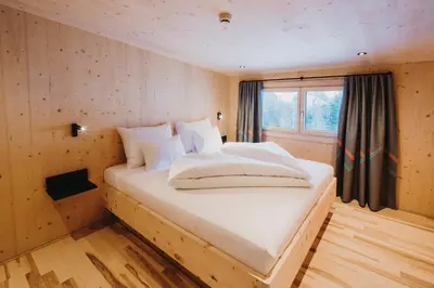Ein Bett oder Betten in einem Zimmer der Unterkunft Alpin - Studios & Suites