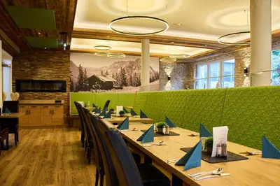 Ein Restaurant oder anderes Speiselokal in der Unterkunft Aparthotel Kleinwalsertal
