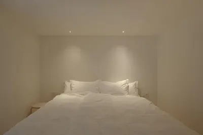 Ein Bett oder Betten in einem Zimmer der Unterkunft BAR10ZIMMER