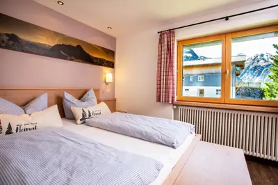 Ein Bett oder Betten in einem Zimmer der Unterkunft Im Höfle Ferienwohnungen