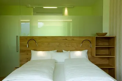 Ein Bett oder Betten in einem Zimmer der Unterkunft Hotel Alpenrose Ebnit