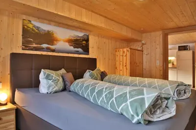 Ein Bett oder Betten in einem Zimmer der Unterkunft Apartments Hänsler