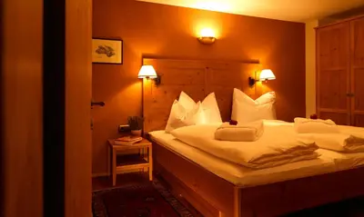 Ein Bett oder Betten in einem Zimmer der Unterkunft Chalet Hus Hörili