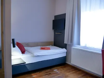 Ein Bett oder Betten in einem Zimmer der Unterkunft Hotel Linde-Sinohaus
