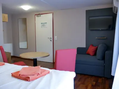 Ein Bett oder Betten in einem Zimmer der Unterkunft Hotel Linde-Sinohaus