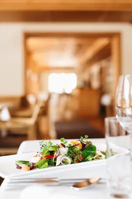 Ein Sitzbereich in der Unterkunft Aparthotel Hubertus Mellau